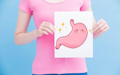 woman holding image of happy stomach